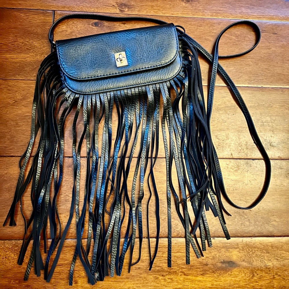 Really cute sling purse in black faux leather with 11 inch fringe.